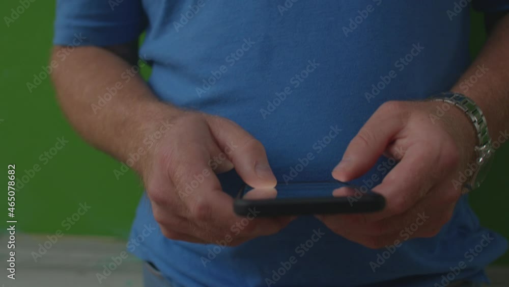 Poster the man presses his fingers on the phone screen. use of mobile internet. checking notifications from