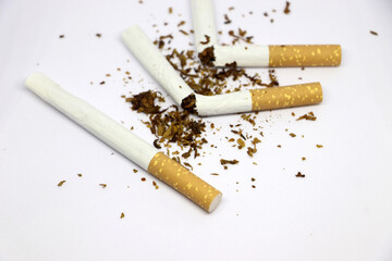 Stop smoking concept. Half and Half broken cigarette isolated on white background, Close up image of broken cigarette, World No Tobacco Day concept.