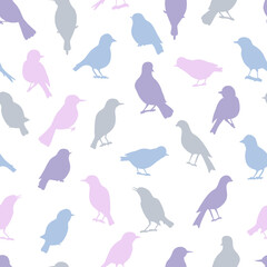 Seamless pattern with colorful silhouettes of birds