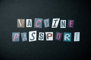 Vaccine passport words. Caption, heading made of letters with different fonts on a dark background.