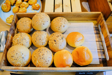 soft rools baked bread in wooden tray