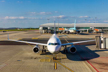 Passenger airplane getting ready for flight. Front view of landed airplane in  International...