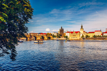 Prague in a sunny day, view of the old town, Prague, Czech Republic. Scenic summer view of the Old Town pier architecture and Charles Bridge over Vltava river in Prague, Czech Republic