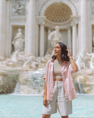woman posing at the trevi fountain