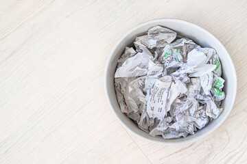 Used sales receipts prepared for recycling. Recyclable materials. Waste to be recycled. Free space.