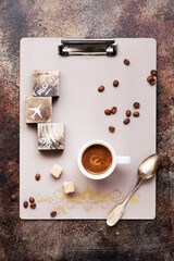 Clipboard with space for text, cup coffee, coffee beans and sugar. Top view. Flat lay style.