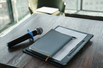 Closeup equipment microphone notebook on table