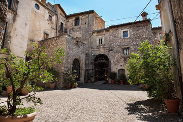 Fototapeta na wymiar Castelvecchio Calvisio medieval town, square, steps, archs and medieval buidings.