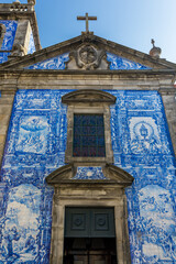 Fototapeta na wymiar Traditional historic facade in Porto decorated with blue hand painted tin-glazed tiles, Oporto, Portugal