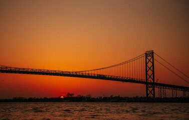 Fototapeta na wymiar Sunset in Widsor, Ontario Canada Ambassador Bridge border between Canada - US