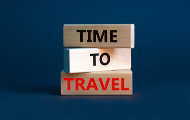 Time to travel symbol. Wooden blocks with concept words 'Time to travel' on beautiful grey background. Business and time to travel concept. Copy space.