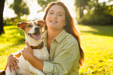 Portrait of happy female woman pet owner hugging playing walking with dog jack russell terrier...