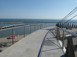 This curved pedestrian bridge connects the upper part of the city of Sassnitz, Ruegen Island,...