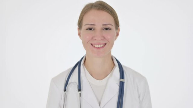 Female Doctor Smiling at Camera on White Background 