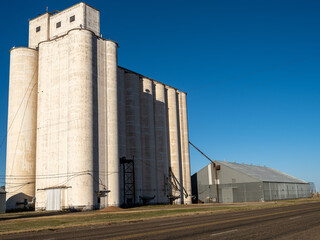 grain silos in the middle of the field in Texas
