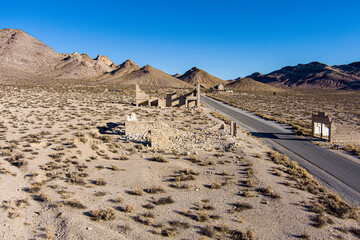 Aerial view of the abandoned ruins of Rhyolite mining camp in the Nevada desert. This Ghost town sits just outside the entrance to Death Valley National Park.