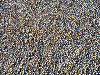 Abstract background photograph of the Route 66 asphalt road in Adrian Texas.