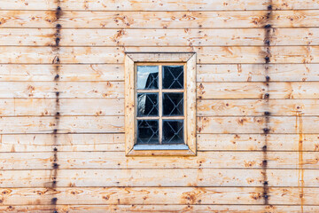 wooden window with lattice in a wooden rural house, empty space, background