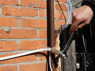 repair of the outlet water pipe from the outside of the brick building, tightening the nozzle on...