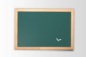 blank green chalkboard on a wall, school and teaching concept,