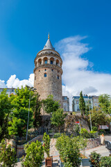 Fototapeta na wymiar Galata Tower in Istanbul in summer, symbolic landmark in Galata area of Istanbul, Turkey. The historical building is famous for tourists