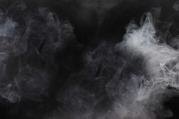 White steam on a black background.