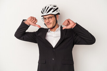 Young business caucasian man holding bike helmet isolated on white background feels proud and self confident, example to follow.