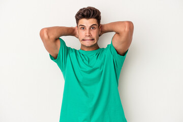 Young caucasian man isolated on white background screaming with rage.