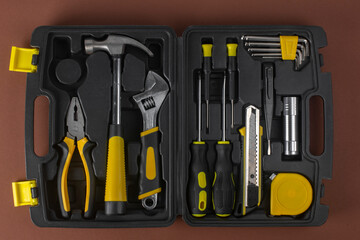 A set of hand tools in a plastic case.
