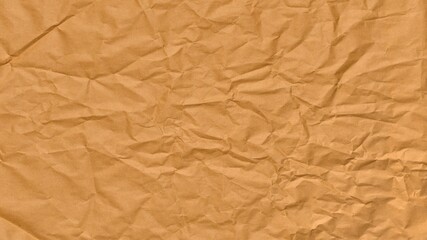 Brown, crumpled paper texture background template close up flat lay top view