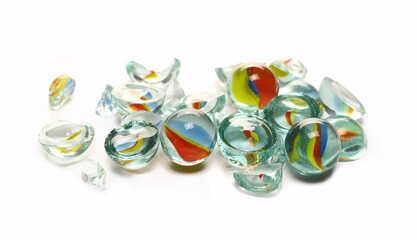 Fototapeta na wymiar Pile of broken colorful glass marbles isolated on white 