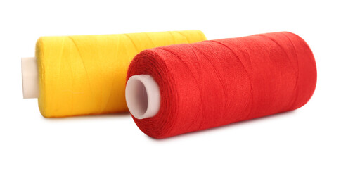 Different colorful sewing threads on white background, closeup
