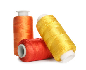 Different colorful sewing threads on white background