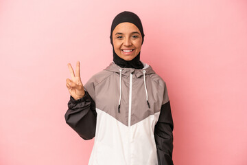 Young Arab woman with sport burqa isolated on pink background showing number two with fingers.