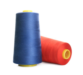 Different colorful sewing threads on white background