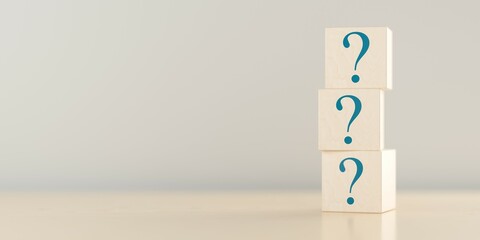 Three wooden blocks or cubes with question mark symbol icons stacked on wooden table, faq, questions or support concept, copy space