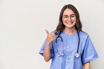 Young caucasian nurse woman isolated on white background smiling and raising thumb up