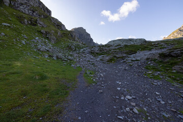 Wonderful view over a beautiful alpine lake in Switzerland called Schottensee. Epic sunrise over a perfect blue lake.