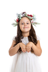 portrait of funny, joyful girl in Christmas wreath, white dress showing paws of rabbit or hare with hands, isolated on white background. 