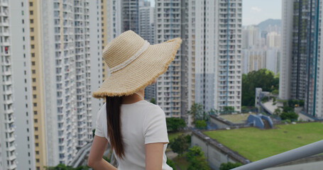 Fototapeta premium Woman look at the city of Hong Kong