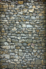 abstract background gray wall of stones close up