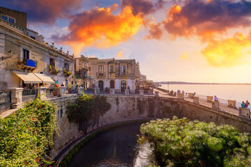 The Fountain of Arethusa and Siracusa (Syracuse) in a sunny summer day. Sicily, Italy. The Fountain...