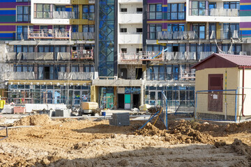Fototapeta na wymiar Photo of the construction of a multi-storey buildings and houses