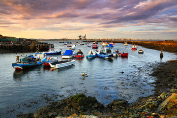 Warm Morning Light on Fishing Boats at South Gare, Middlesbrough, North Yorkshire, England, UK.