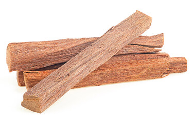 Chandan or sandalwood. Pile of sandalwood sticks isolated on a white background, close up.