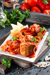 Fish stew with tomato in a plate