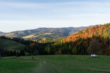 abandoned caravan on grassland at autumn