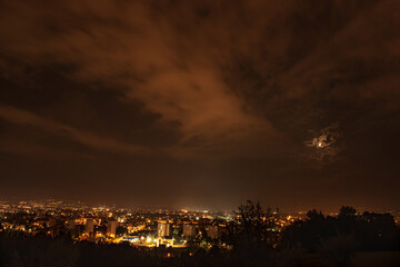 clouds over the city in the middle of the night © Robert