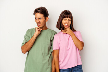 Young mixed race couple isolated on white background touching back of head, thinking and making a choice.