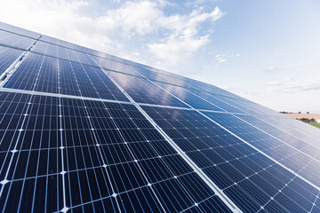 Obraz premium Solar panel photo close up on blue sky background, renewable energy eco